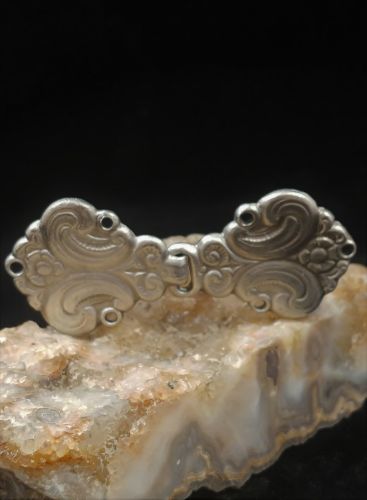 Cloak Clasp Flourish Design